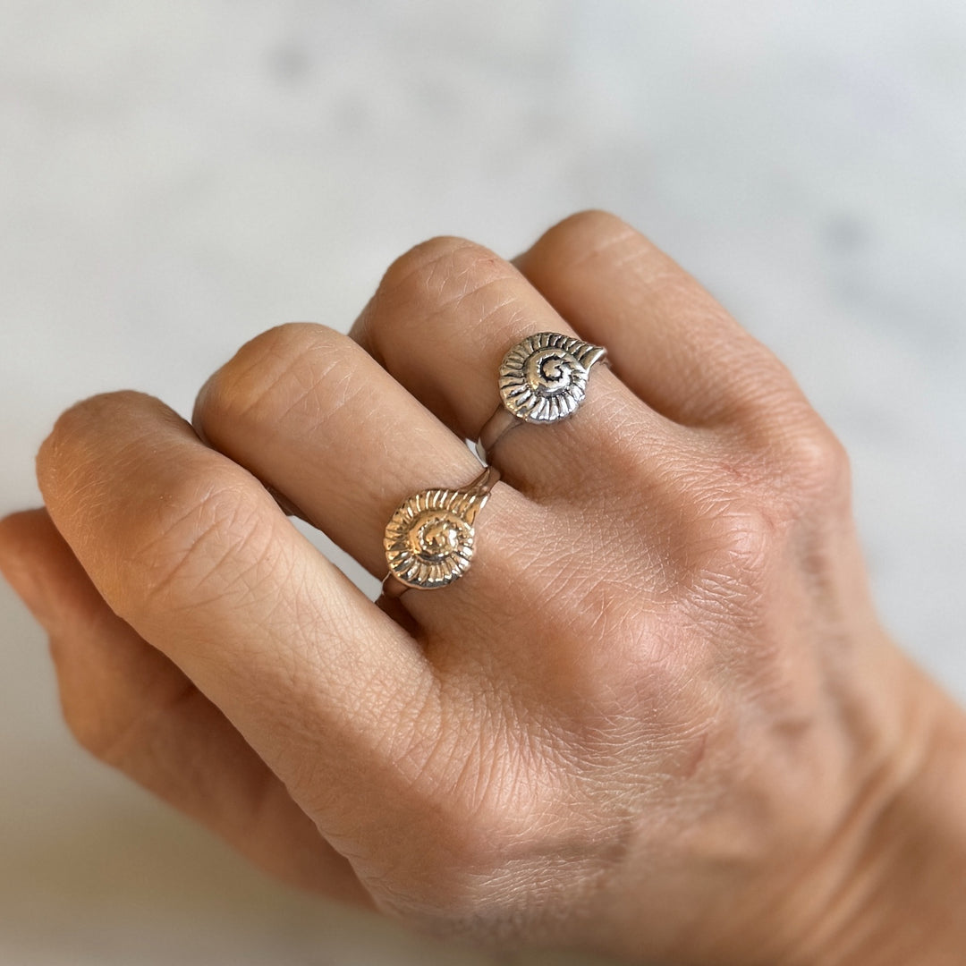 Person Wears Bronze and Sterling Silver Snail Shell Rings