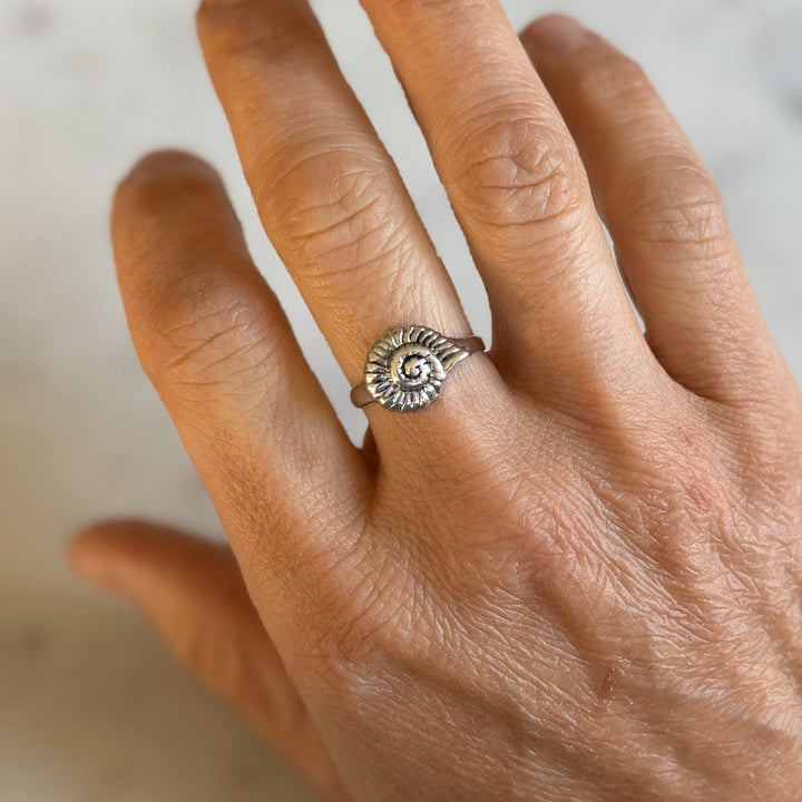Person Wears Sterling Silver Snail Shell Ring on Middle Finger