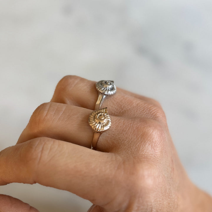 Person Wears Bronze and Sterling Silver Snail Shell Rings