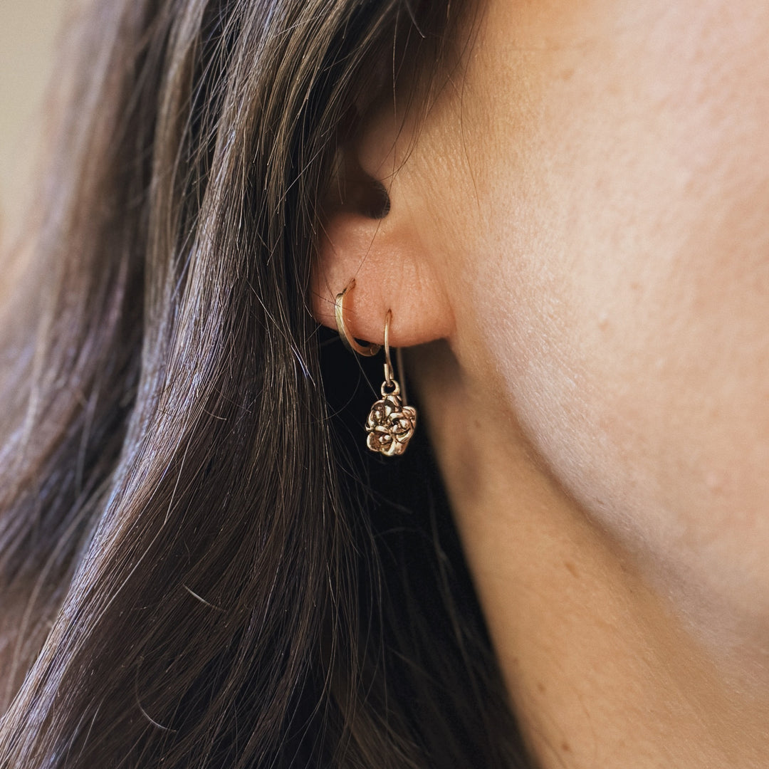 Person wears Bronze Succulent Earrings from MIMOSA Handcrafted