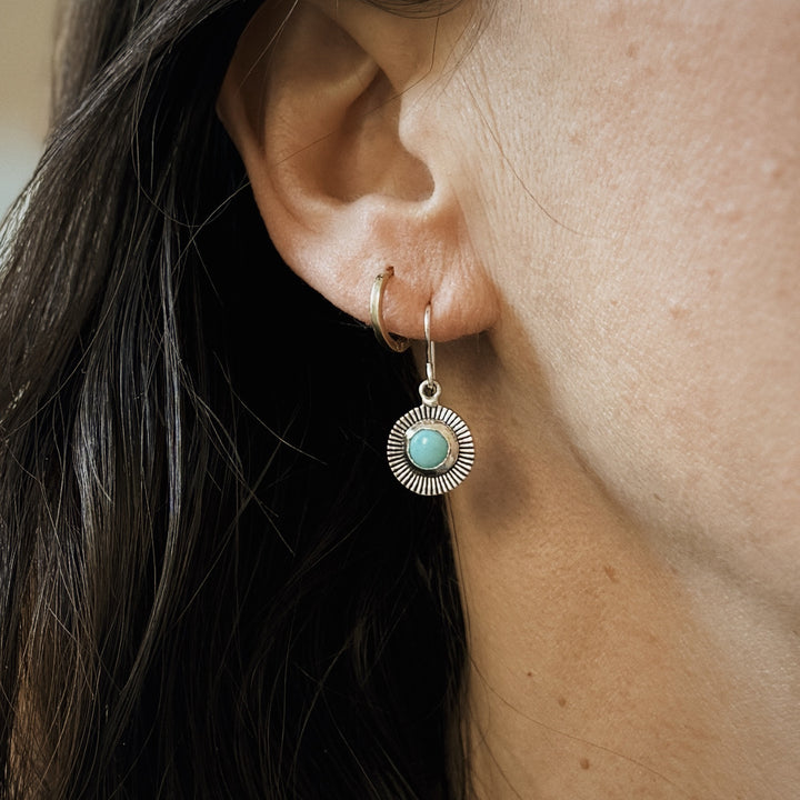 Woman Wears Sterling Silver and Turquoise Sunburst Earrings | MIMOSA Handcrafted