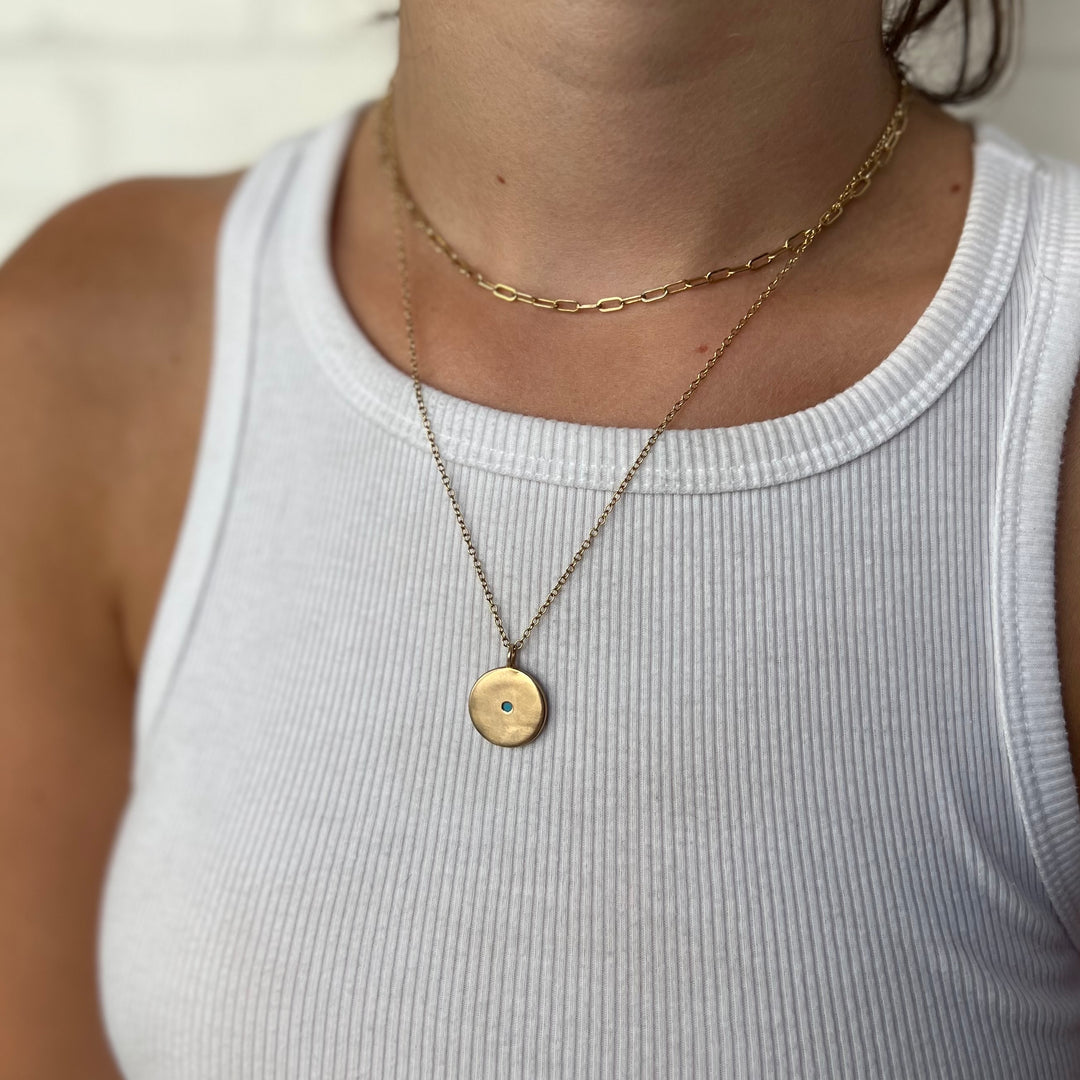Woman Wearing Handcrafted Minimal Circle Pendant Necklace With A Two Millimeter Stone