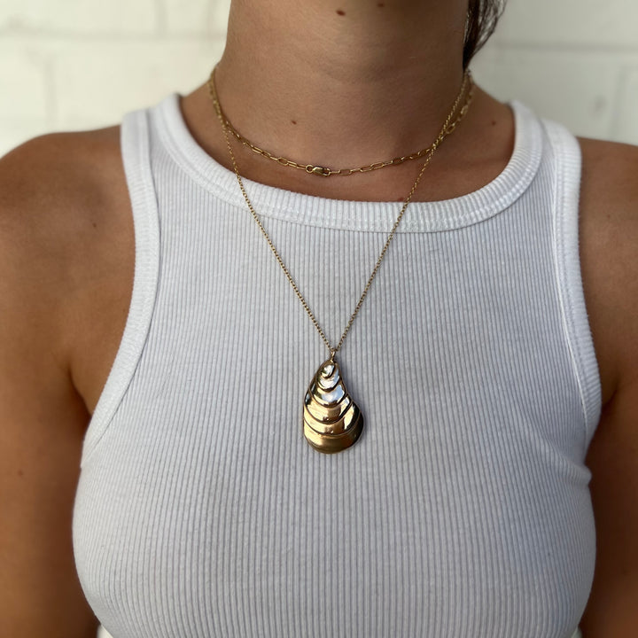 Woman Wearing Handcrafted Oyster Shell Pendant Necklace