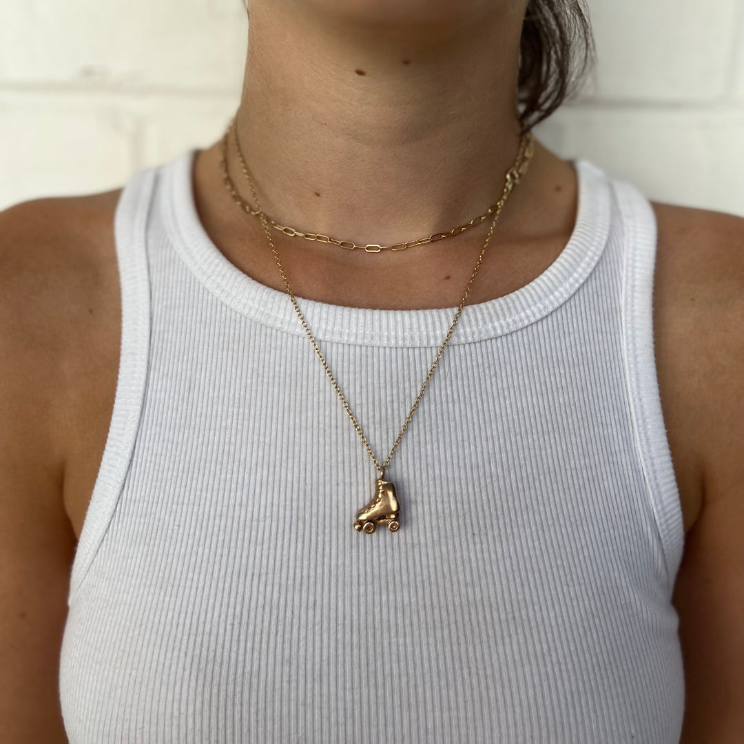 Woman Wearing Handcrafted Bronze Roller Skate Pendant Necklace