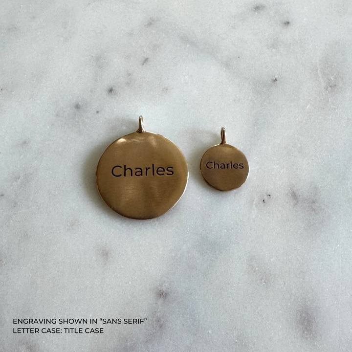 Large and small round bronze pendants engraved with the name &