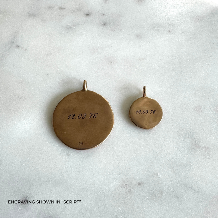Large and small round bronze pendants engraved with the date &
