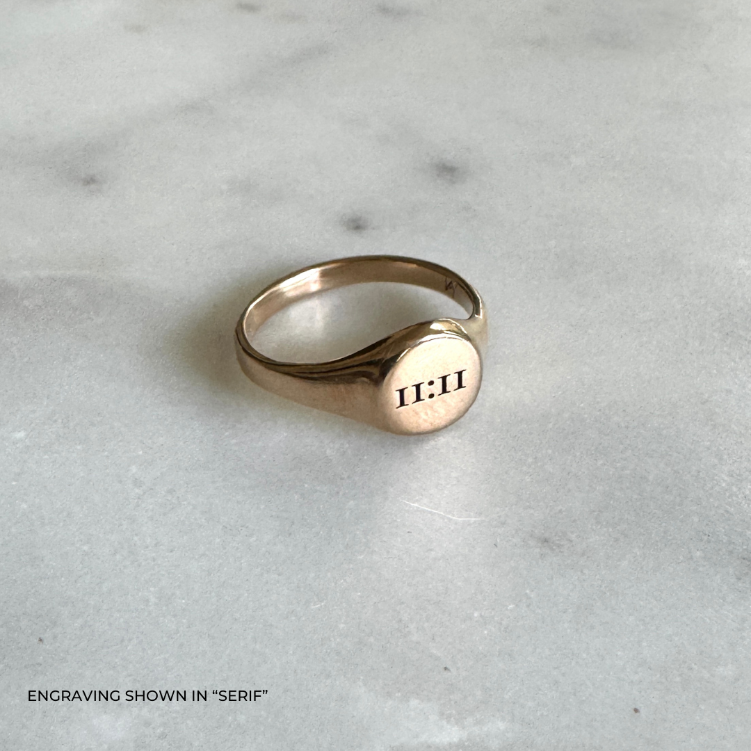 A bronze signet ring with the the time &