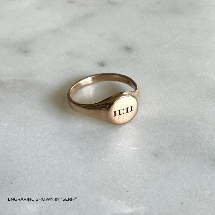 A bronze signet ring with the the time &