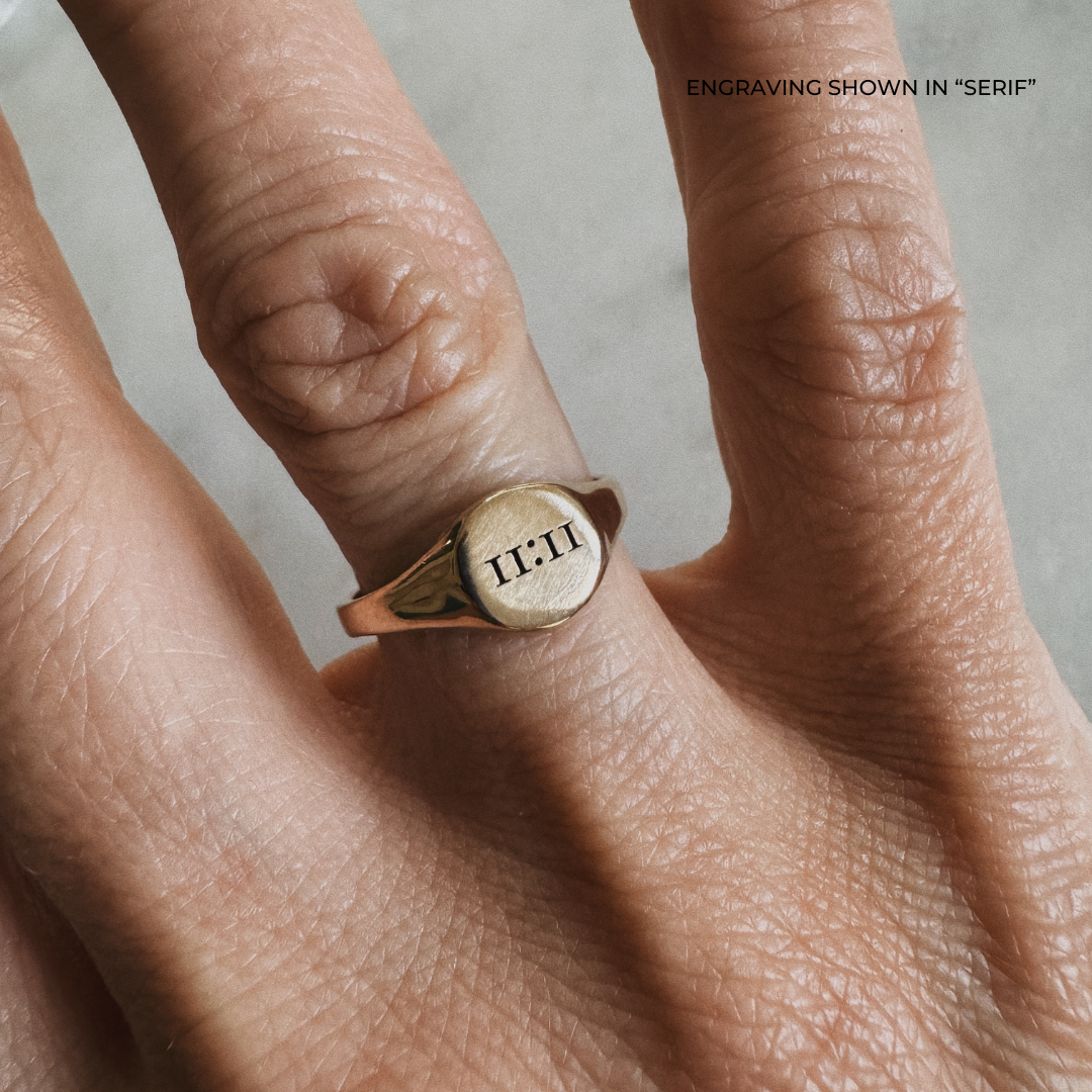 A bronze signet ring with the the time &