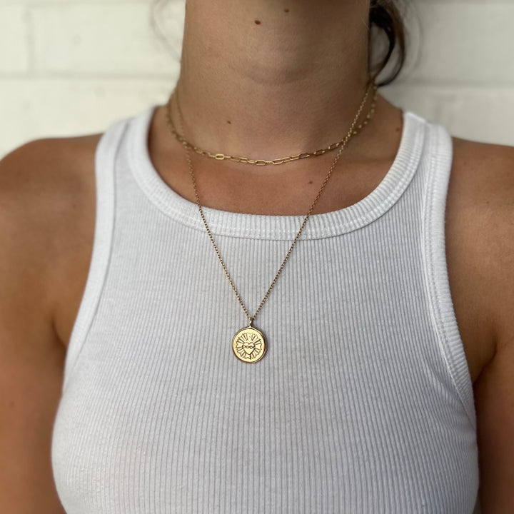 Woman Wearing Handcrafted Sacred Heart Pendant Necklace