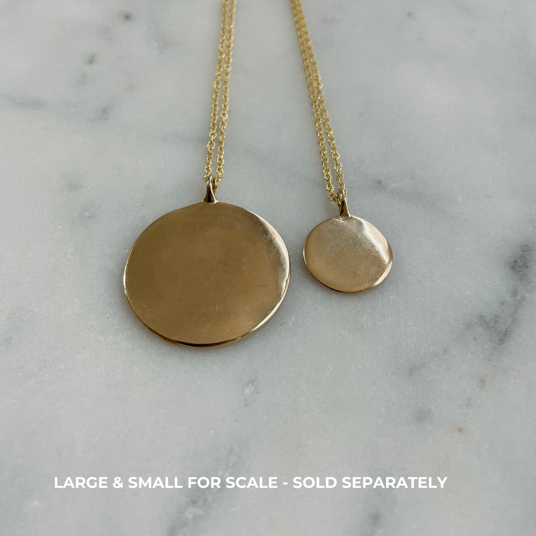 Large and Small engravable pendants side by side in bronze