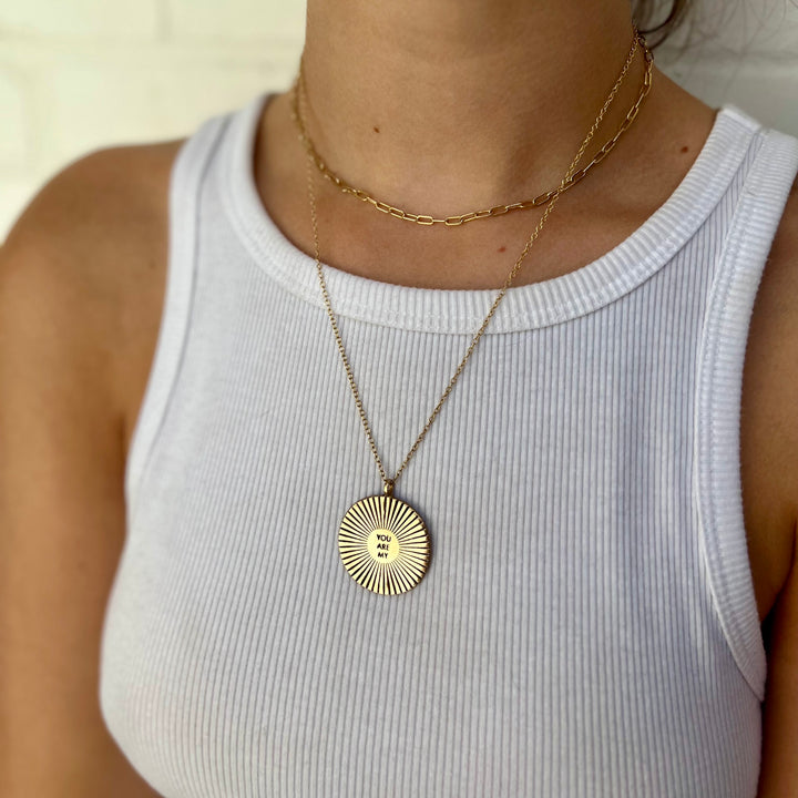 Woman Wearing Handcrafted You Are My Sunshine Circular Pendant Necklace