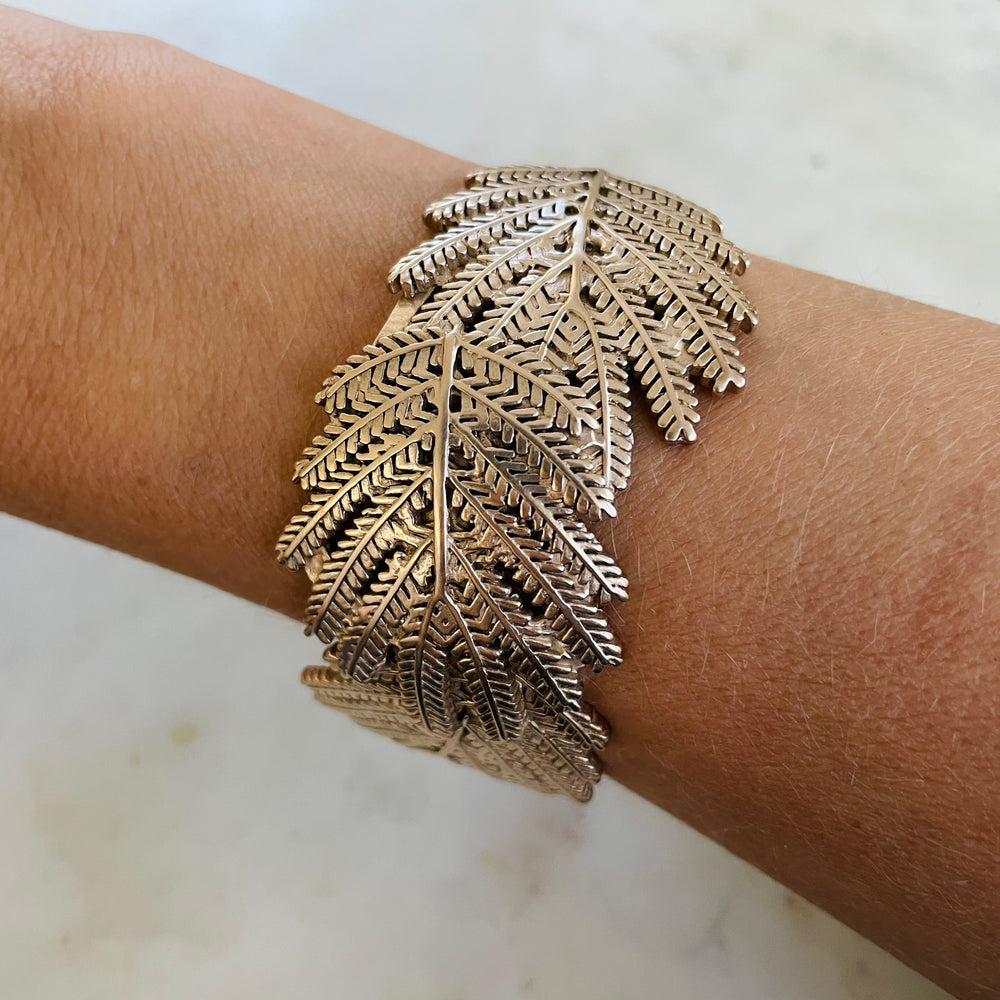 Woman Wearing Handmade Bronze Mimosa Leaf Cuff Bracelet