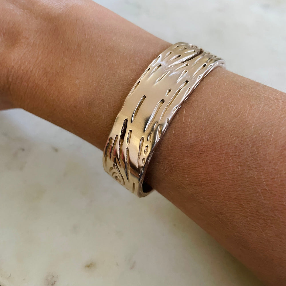 Woman Wearing Handmade Bronze Pecky Cypress Cuff Bracelet