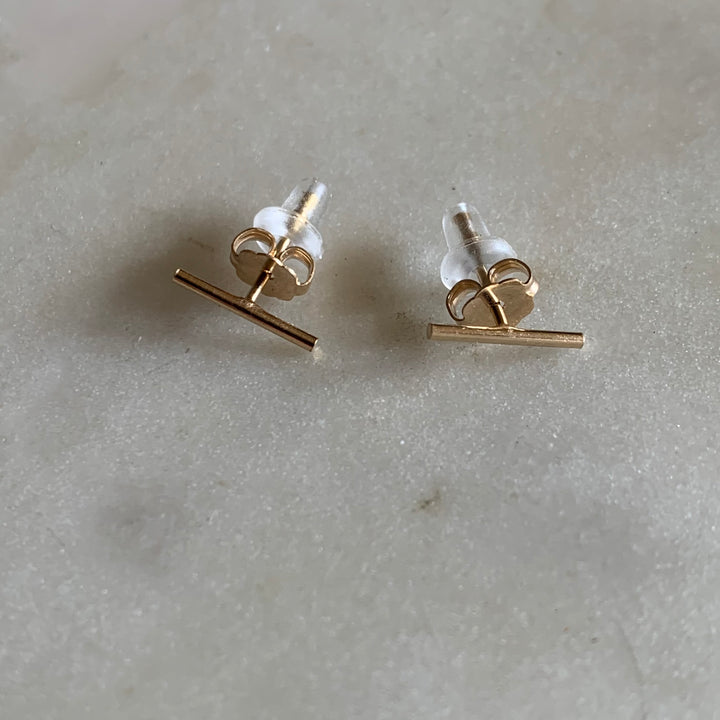Gold-filled bar stud earrings with ear nuts and rubber backs