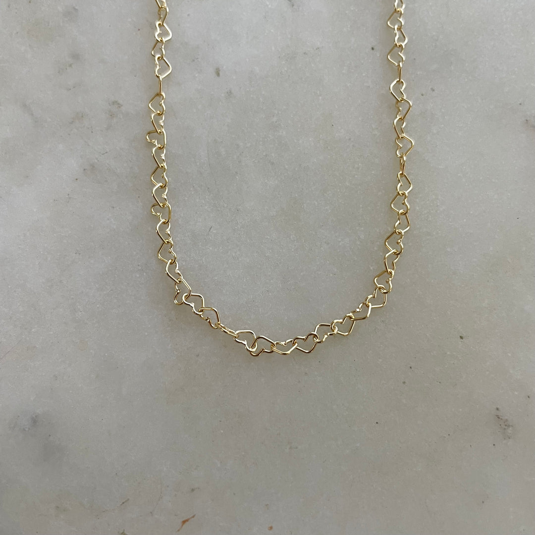 This Dainty Gold-Filled Heart Chain Necklace Features Heart-Shaped Links.