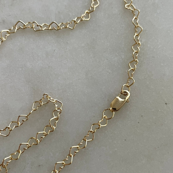 Dainty Gold-Filled Heart Chain Necklace Features Heart-Shaped Links.