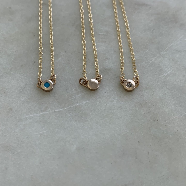 Three Handmade Bronze Grace Pendant Necklaces with Turquoise Stone, No Stone, and Diamond Stone
