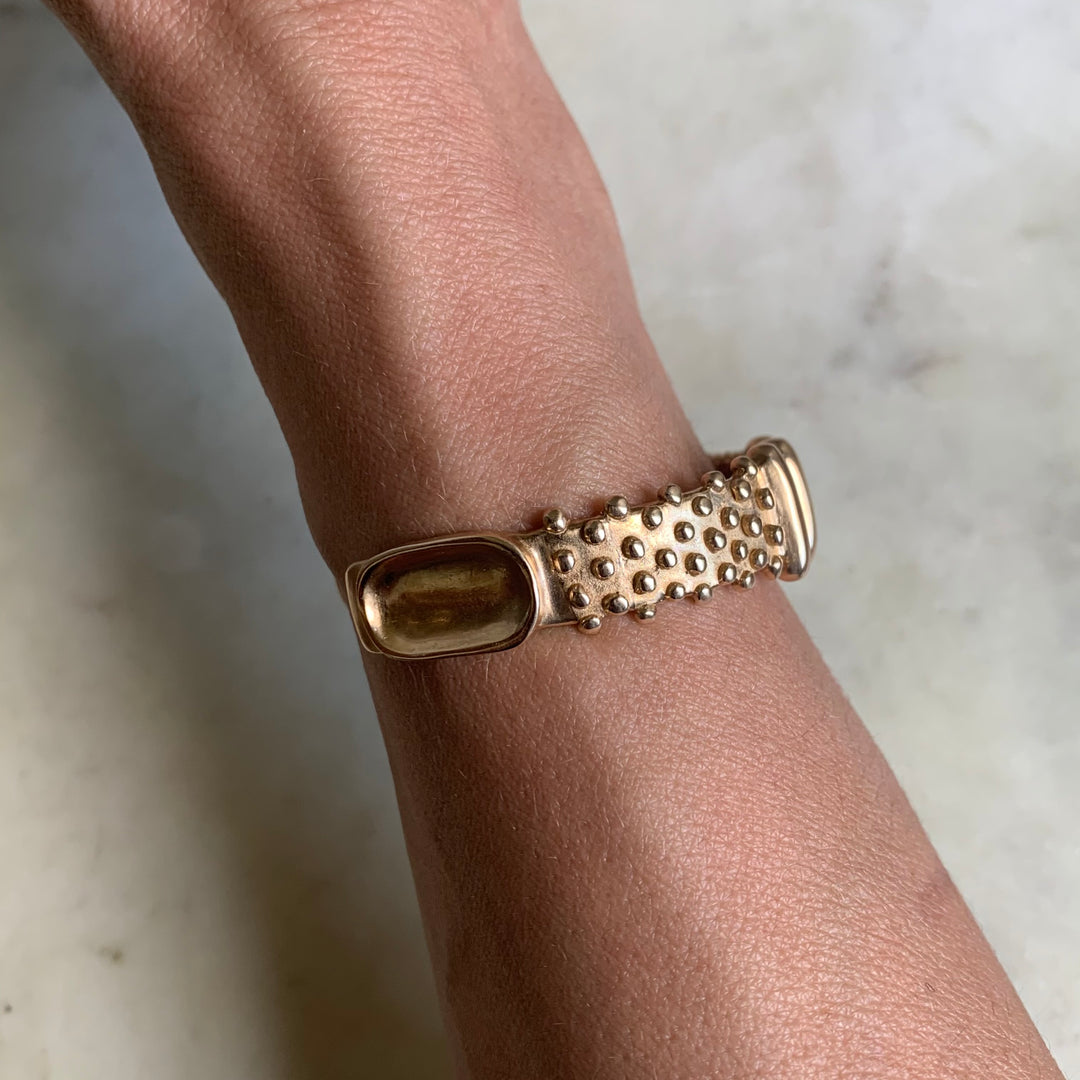 Woman Wearing Handmade Bronze Tactile Cuff With Different Textures