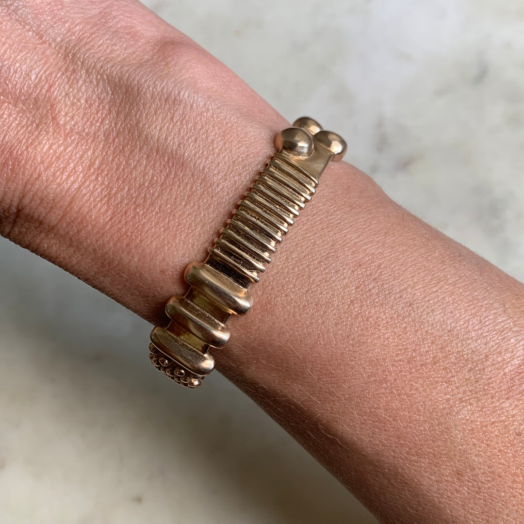 Woman Wearing Handmade Bronze Tactile Cuff With Different Textures