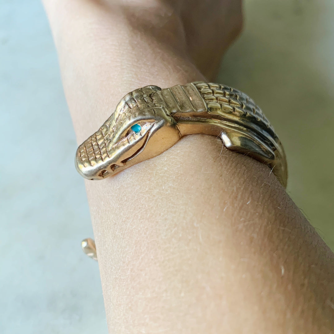 Woman Wearing Handmade Bronze Alligator Cuff Bracelet with Turquoise Eyes