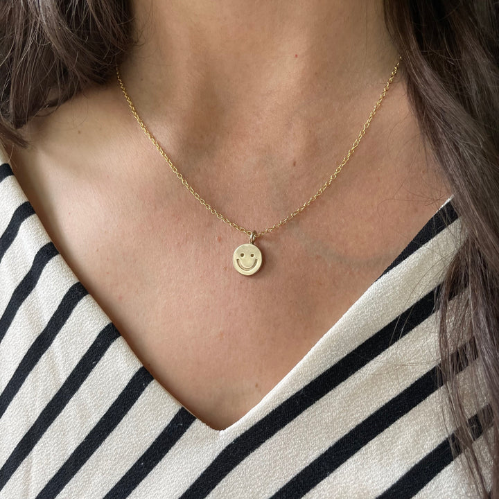 Woman Wearing Handcrafted Happy Face Pendant Necklace