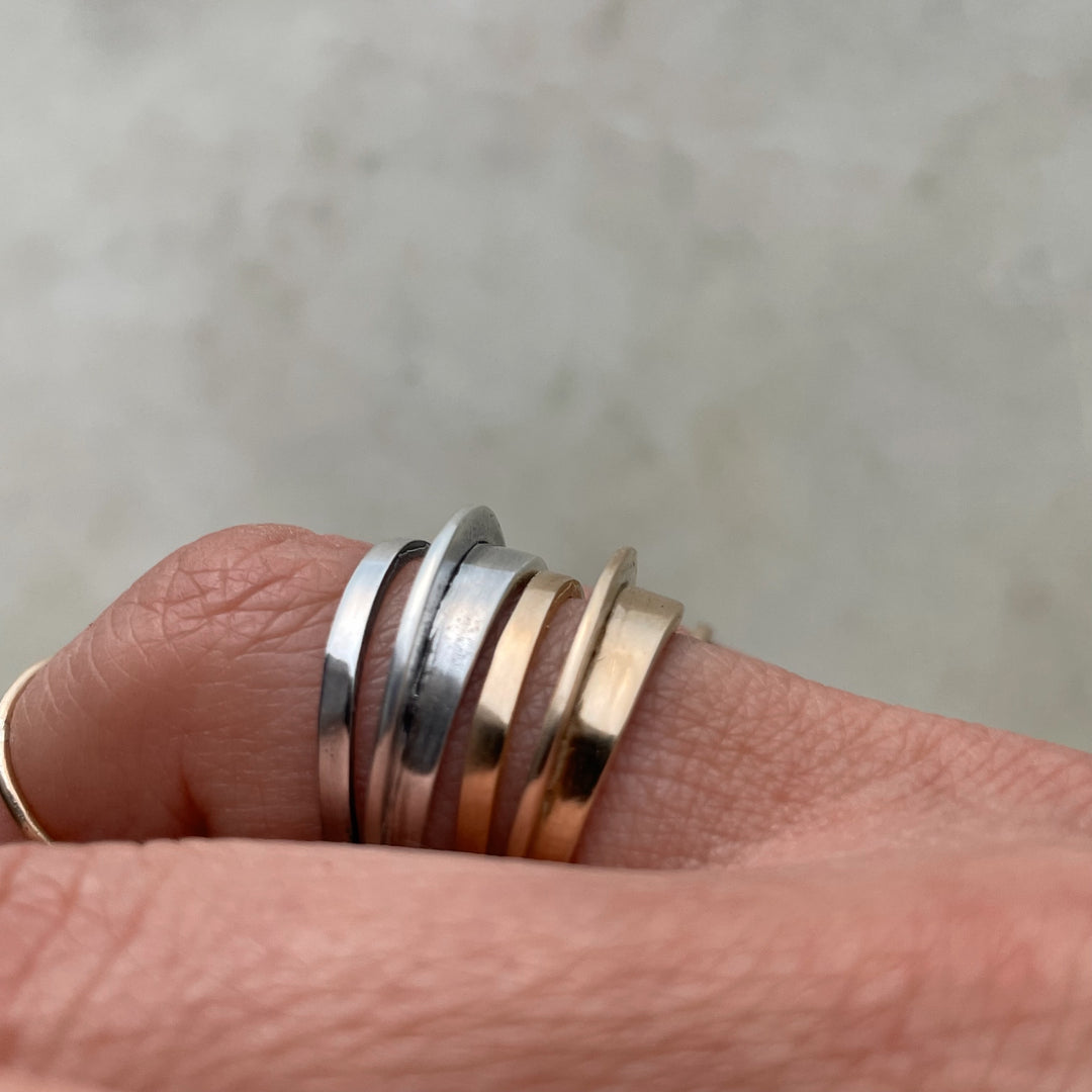 Madeline Wears Bronze And Sterling Silver Stacking Rings From MIMOSA Handcrafted