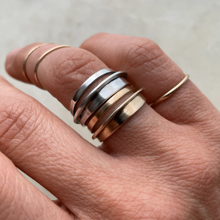 Madeline Wears Bronze And Sterling Silver Stacking Rings From MIMOSA Handcrafted
